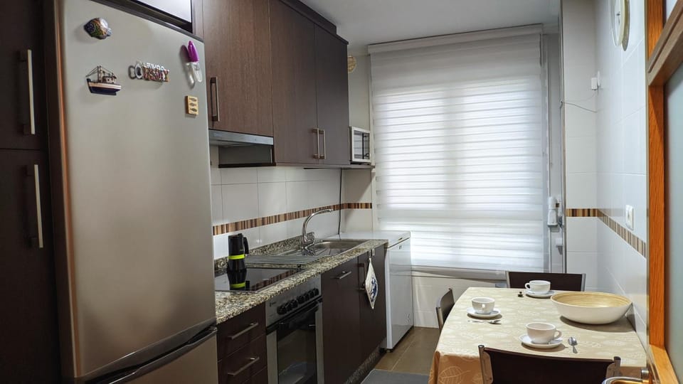 Kitchen or kitchenette, dishwasher, oven, stove