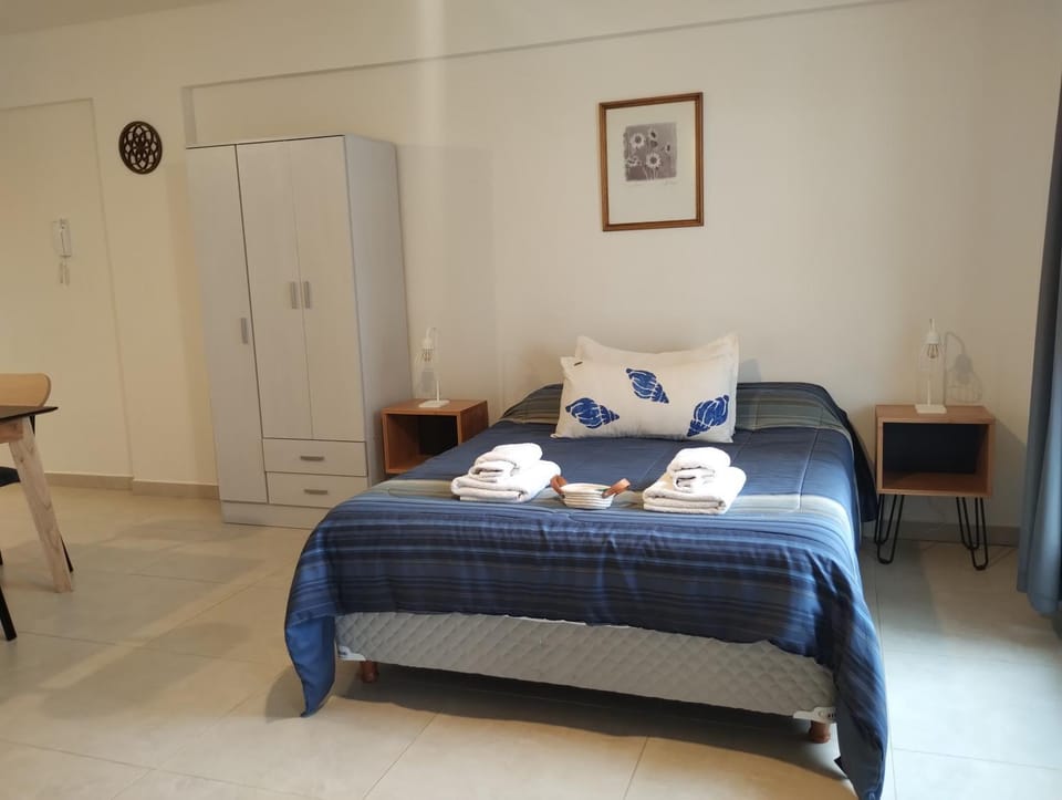 Bed, towels, wardrobe