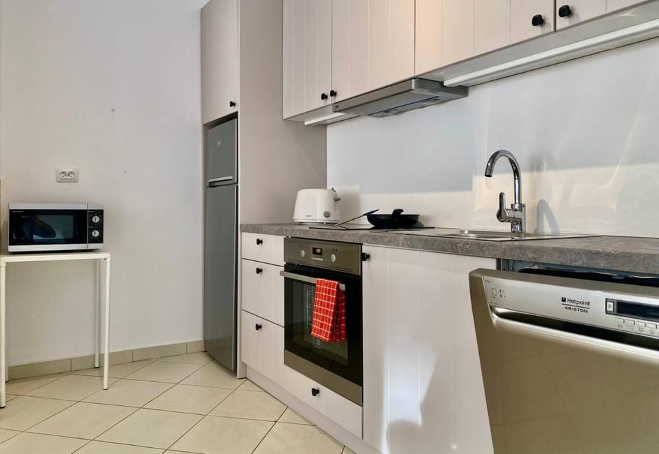 Kitchen or kitchenette, dishwasher, microwave, oven, stove, toaster
