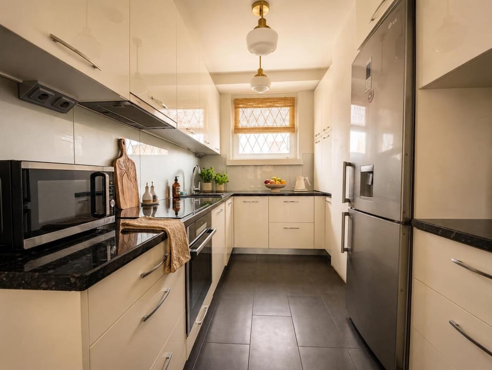 Kitchen or kitchenette, dishwasher, oven, stove