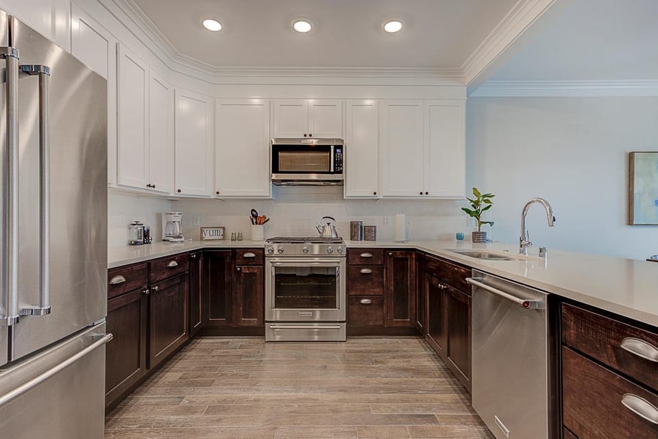 Kitchen or kitchenette, dishwasher, oven, stove