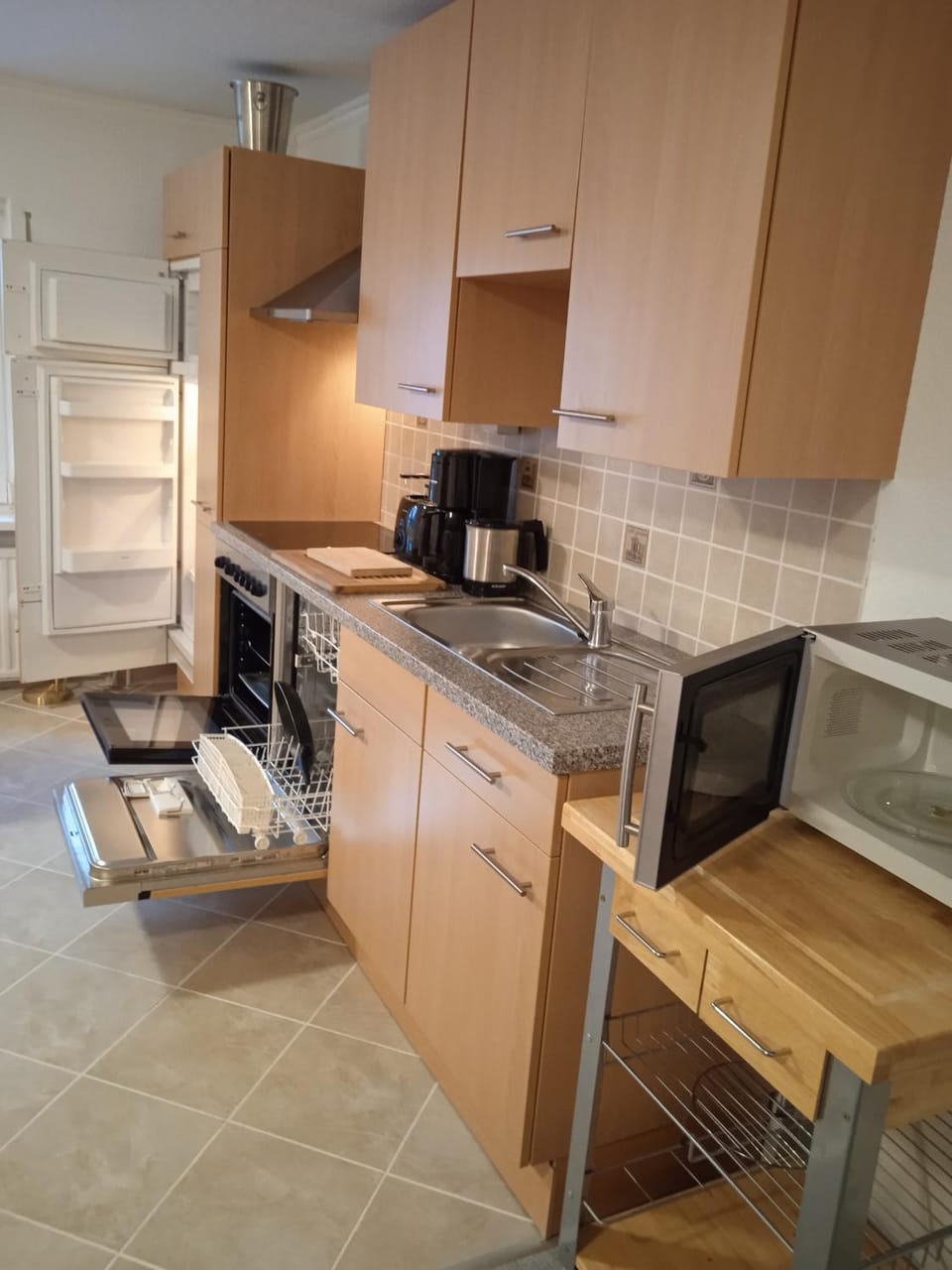 Kitchen or kitchenette, dishwasher, oven, stove, toaster