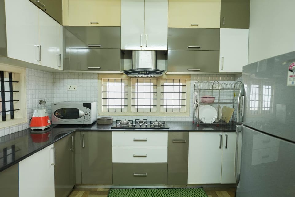 Kitchen or kitchenette, microwave, oven, storage, stove, toaster, kitchen, kitchen