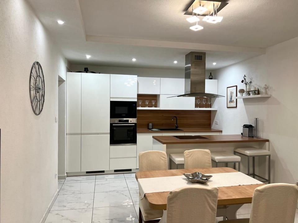 Dining area, dishwasher, oven, stove, kitchen