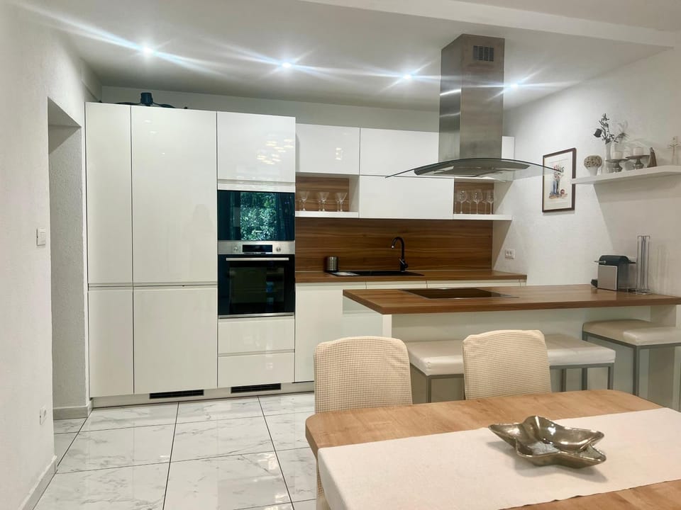 Dining area, microwave, stove, kitchen