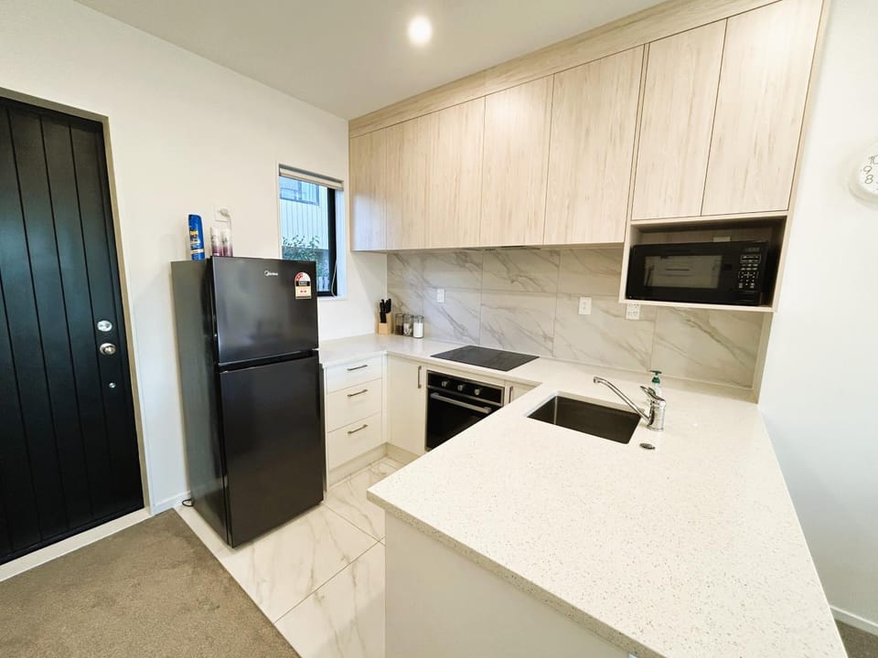 Kitchen or kitchenette, dishwasher, oven, stove