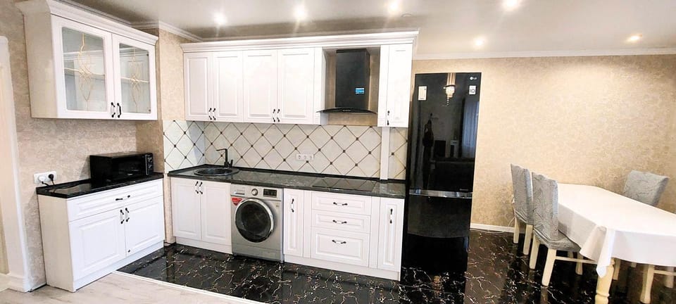 Dining area, microwave, stove, washing machine, kitchen