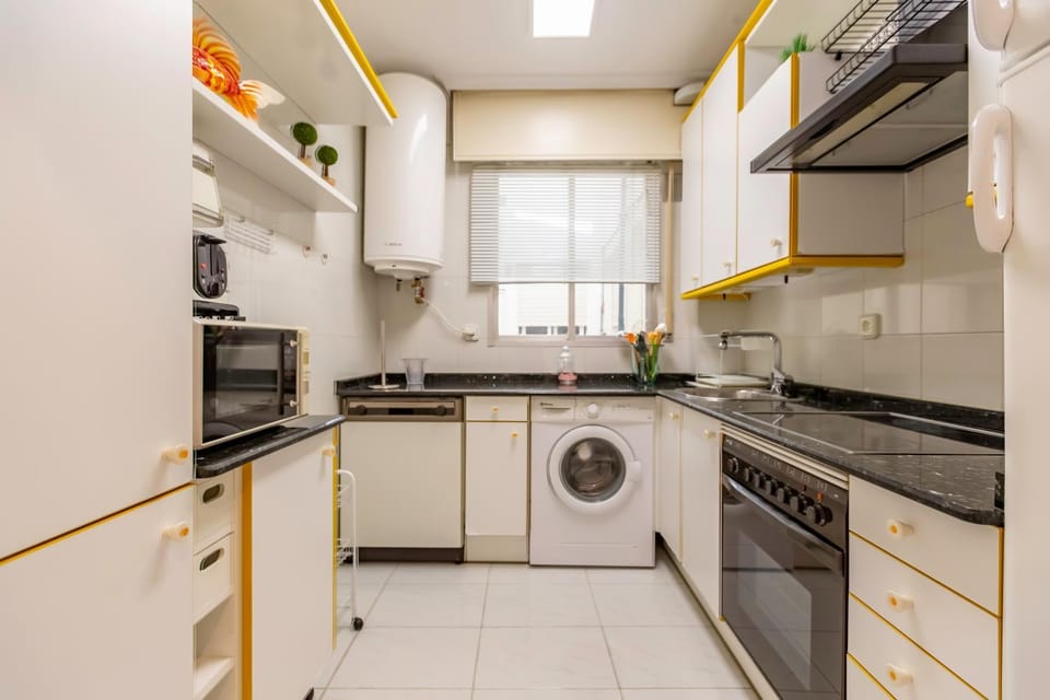 Kitchen or kitchenette, dishwasher, stove, washing machine