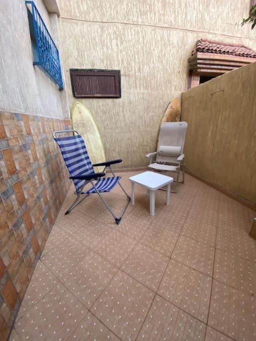 Patio, Natural landscape, Seating area, Beach, Windsurfing, sunbed