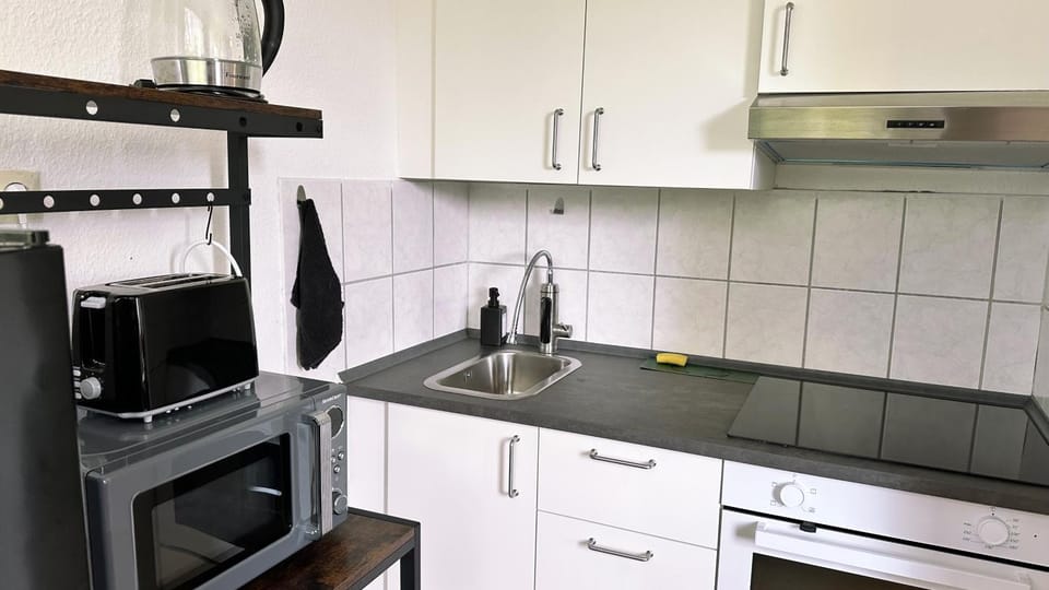Kitchen or kitchenette, microwave, oven, stove, toaster