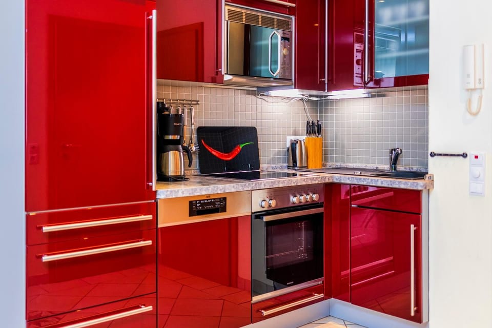Kitchen or kitchenette, dishwasher, oven, stove, toaster