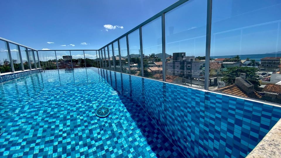 Passos da praia c/ piscina apto iluminado e novo Apartment in Florianopolis