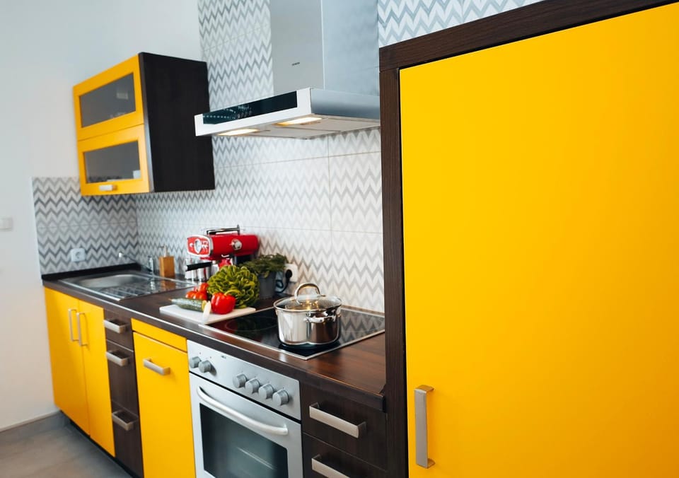 Kitchen or kitchenette, dishwasher, oven, stove