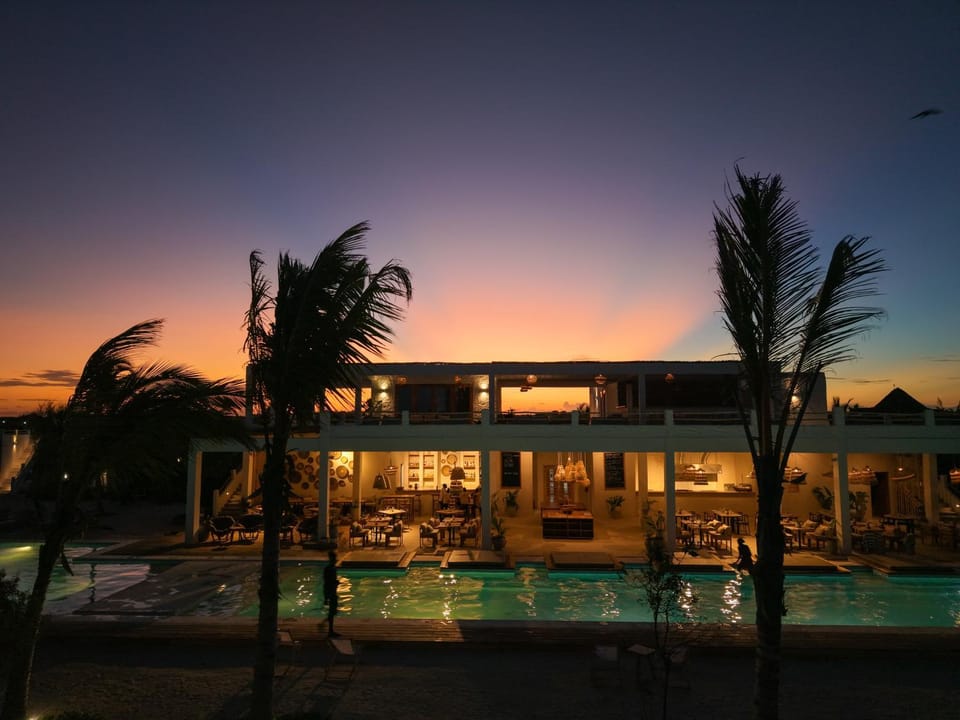 Property building, Restaurant/places to eat, Restaurant/places to eat, Night, View (from property/room), Swimming pool, Sunset