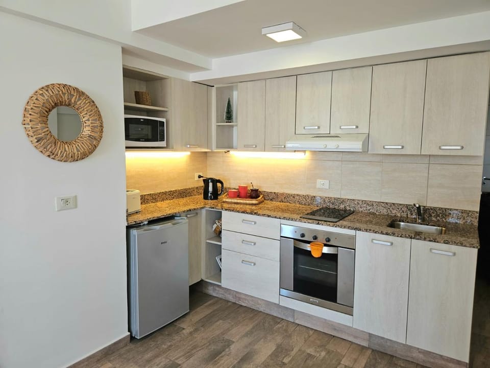 Kitchen or kitchenette, oven, toaster