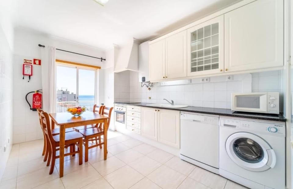 Kitchen or kitchenette, Dining area, Garden view, Sea view, dishwasher, oven, stove, washing machine