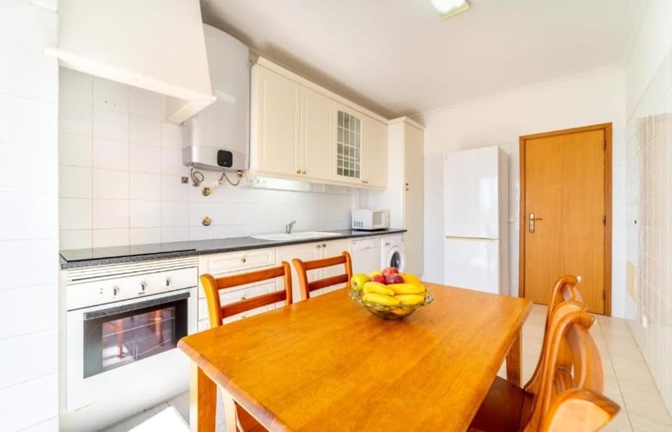 Kitchen or kitchenette, dishwasher, oven, stove
