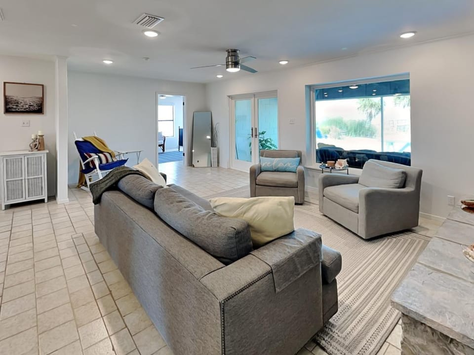 Living room, Seating area, Pool view, Swimming pool, furniture, air conditioner