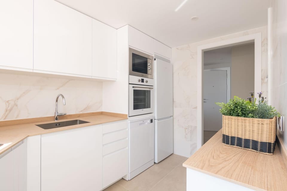 Kitchen or kitchenette, dishwasher, oven, stove