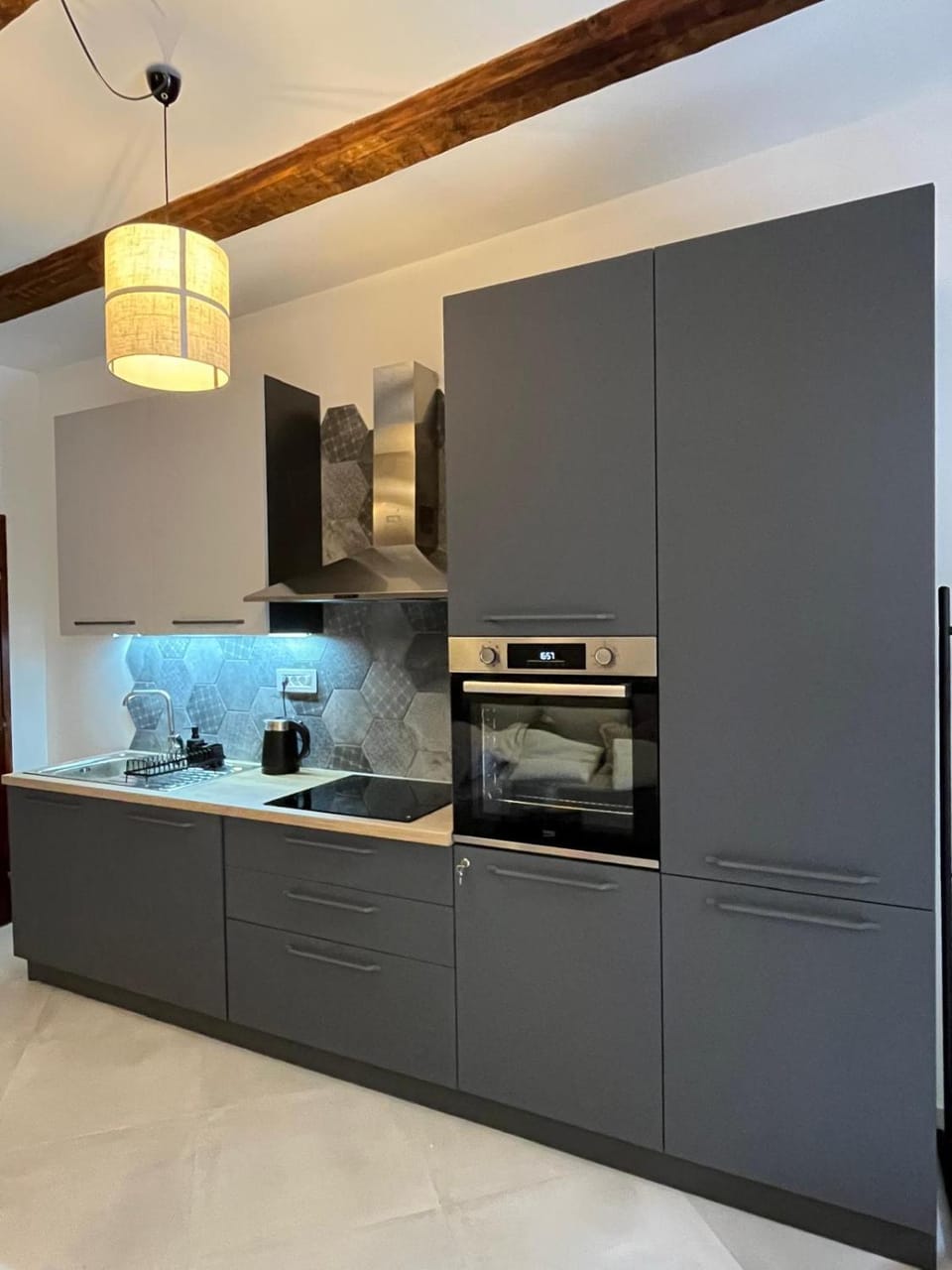 Kitchen or kitchenette, dishwasher, oven, stove