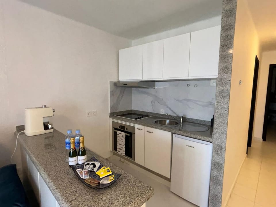 Kitchen or kitchenette, oven, stove