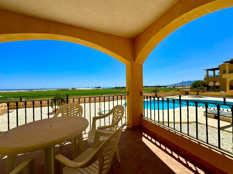 Property building, Patio, Day, Natural landscape, View (from property/room), Balcony/Terrace, Living room, Seating area, Dining area, Pool view, Swimming pool, sunbed