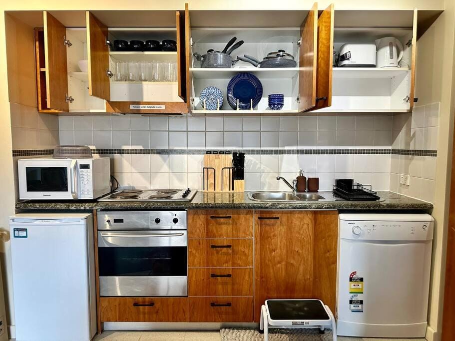 Kitchen or kitchenette, dishwasher, oven, stove, toaster
