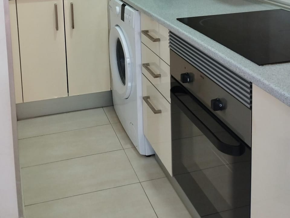 Kitchen or kitchenette, washing machine