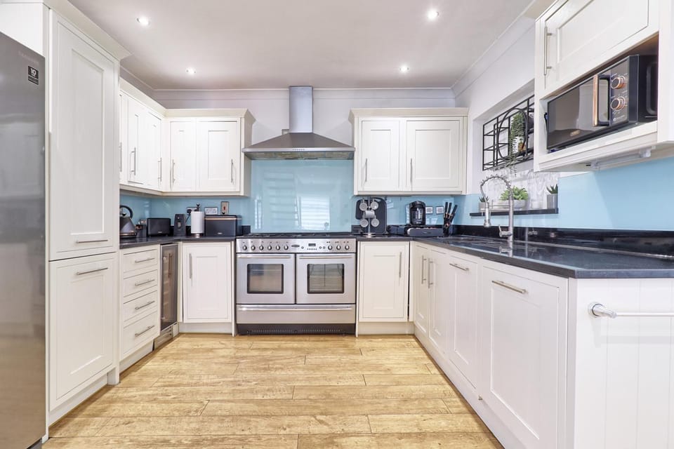 Kitchen or kitchenette, dishwasher, oven, stove, toaster