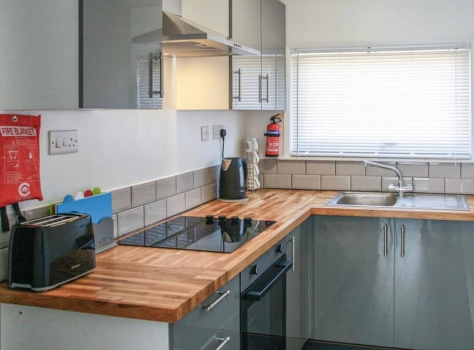 Kitchen or kitchenette, stove, toaster