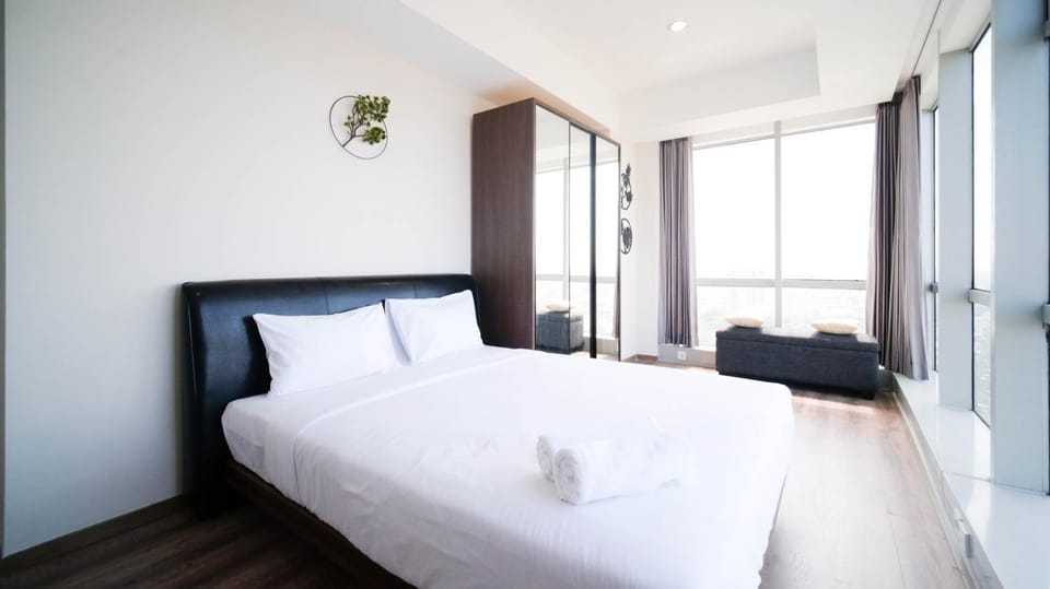 Minimalist with Beautiful View 2BR at Grand Sungkono Lagoon Apartment By Travelio Apartment in Surabaya