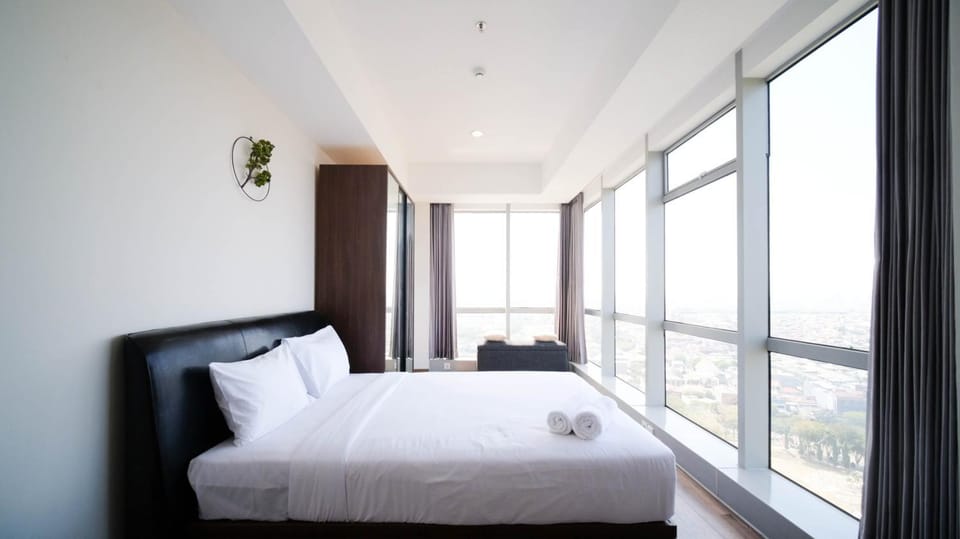 Minimalist with Beautiful View 2BR at Grand Sungkono Lagoon Apartment By Travelio Apartment in Surabaya