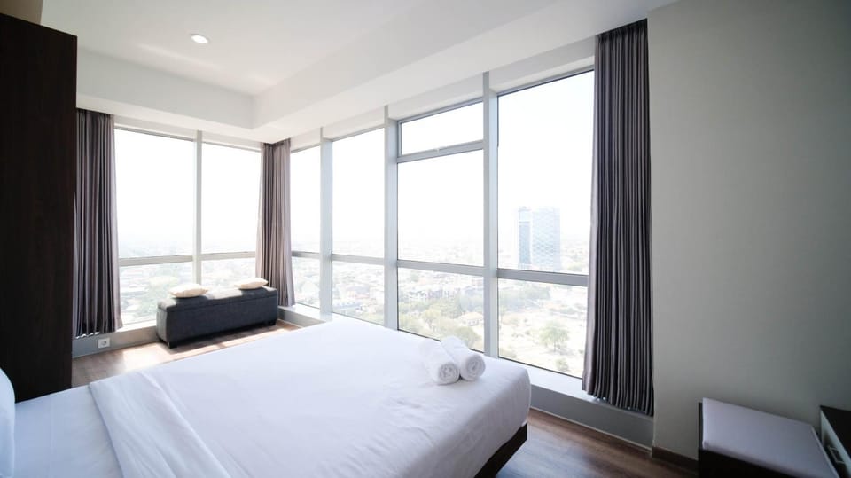 Minimalist with Beautiful View 2BR at Grand Sungkono Lagoon Apartment By Travelio Apartment in Surabaya
