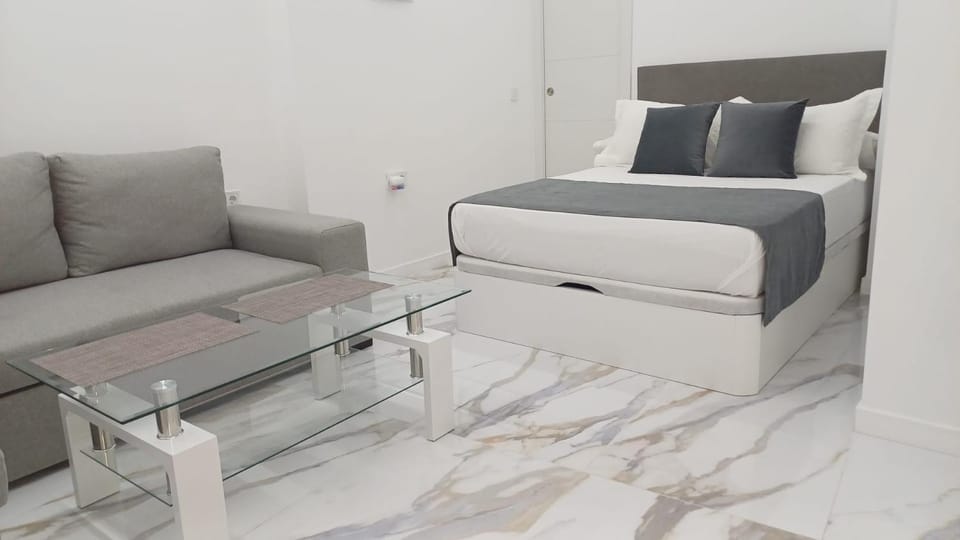 Bed, Living room, Seating area, Bedroom