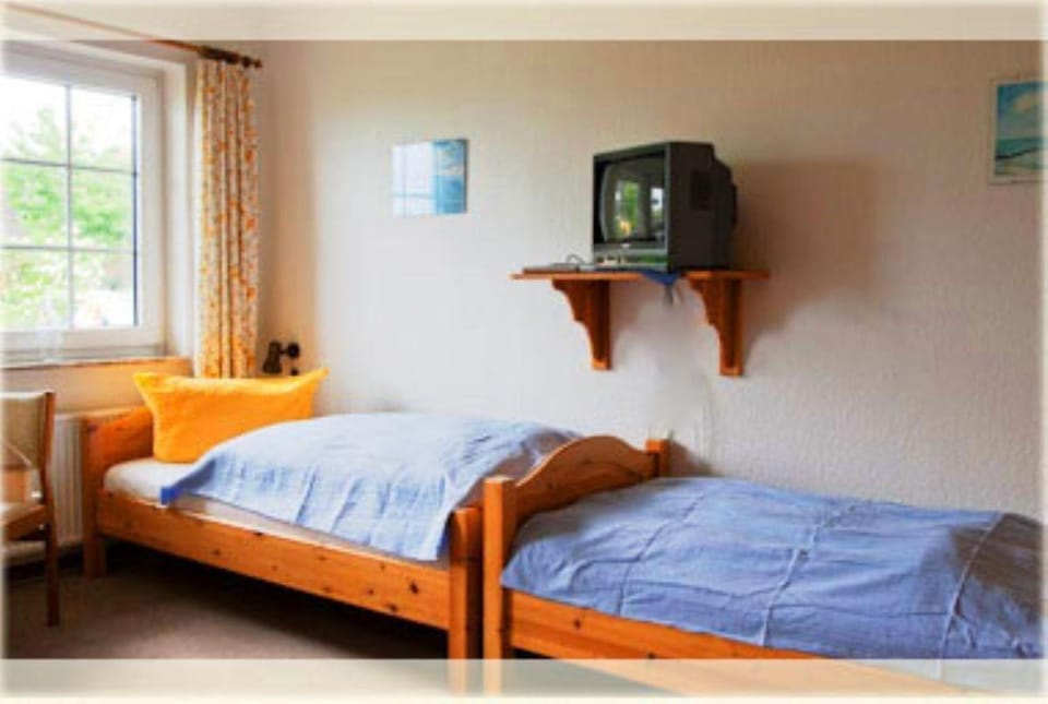 Heckenrose4-EG-mitte Apartment in Norddorf