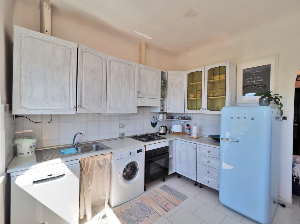Kitchen or kitchenette, dishwasher, stove, washing machine