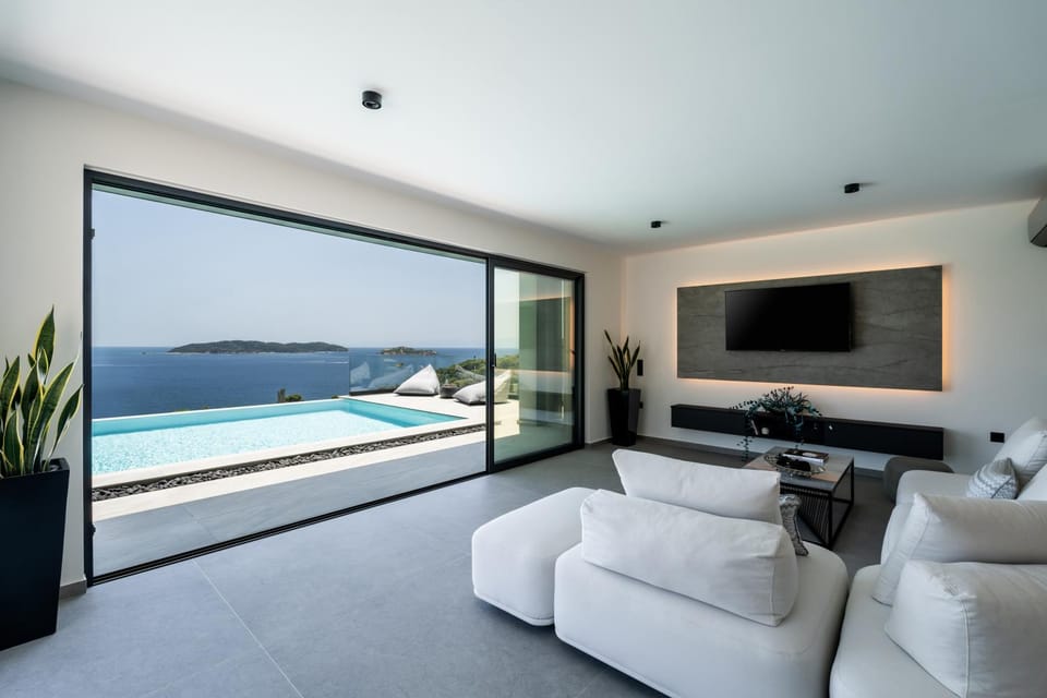 Living room, Seating area, Pool view, Sea view