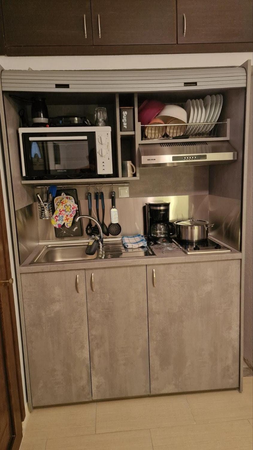 Kitchen or kitchenette, stove