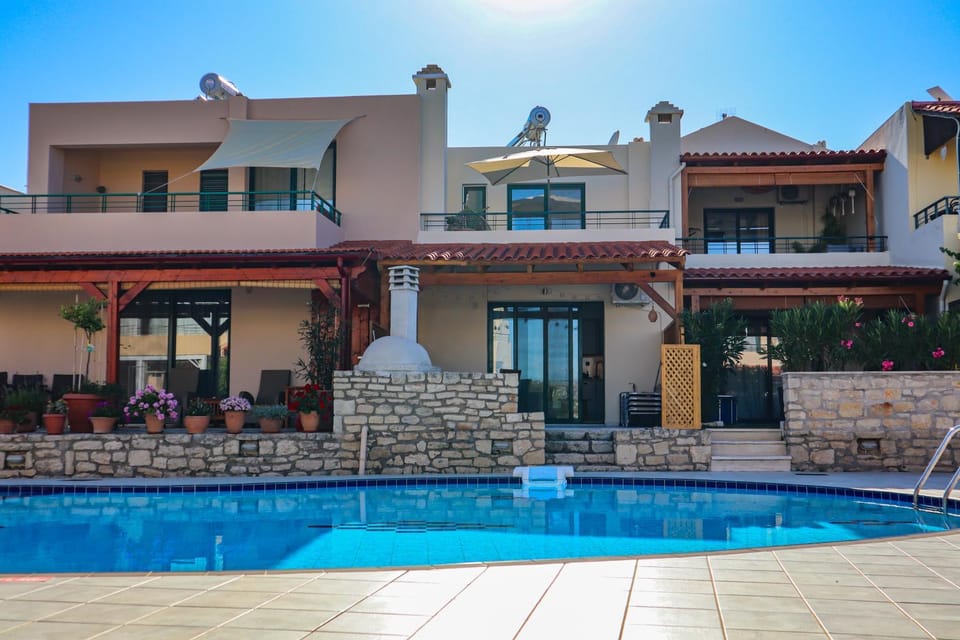 Property building, Patio, Pool view, Swimming pool, sunbed