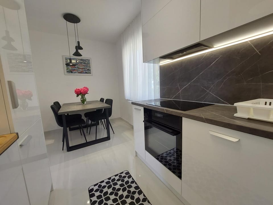 Dining area, dishwasher, stove, kitchen