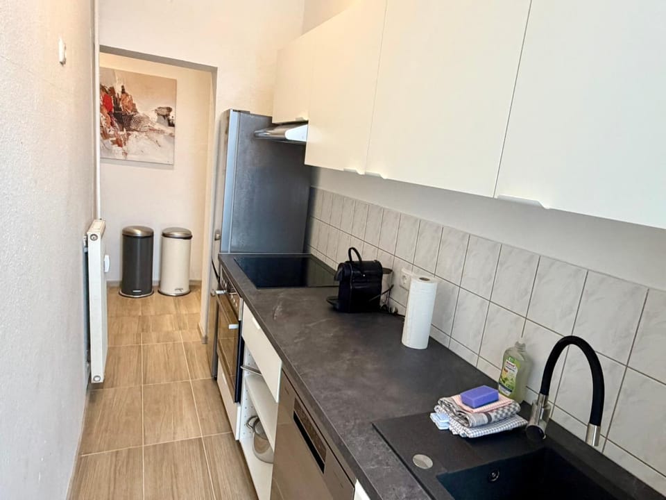 Kitchen or kitchenette, dishwasher, oven, stove