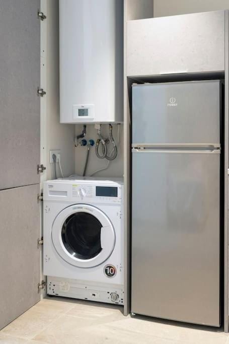 Kitchen or kitchenette, oven, washing machine, dryer