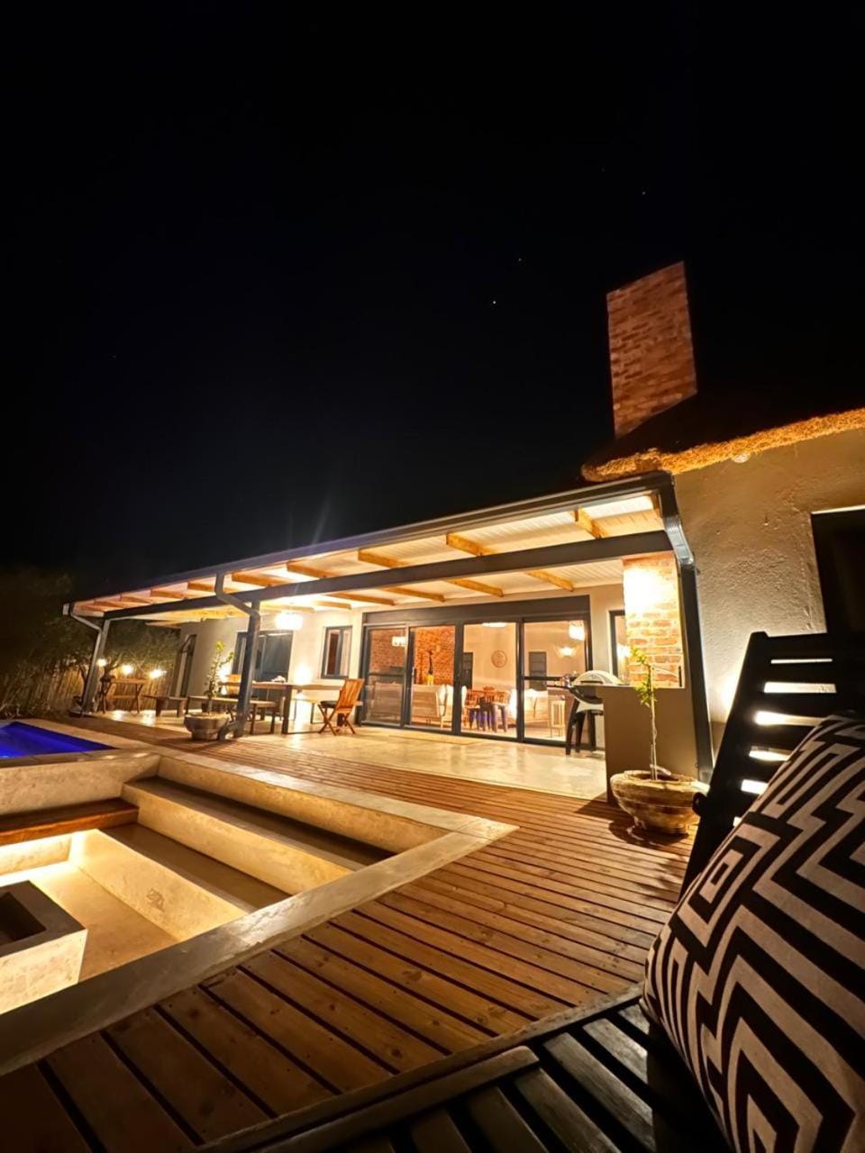 Property building, Patio, Night, Pool view, Swimming pool