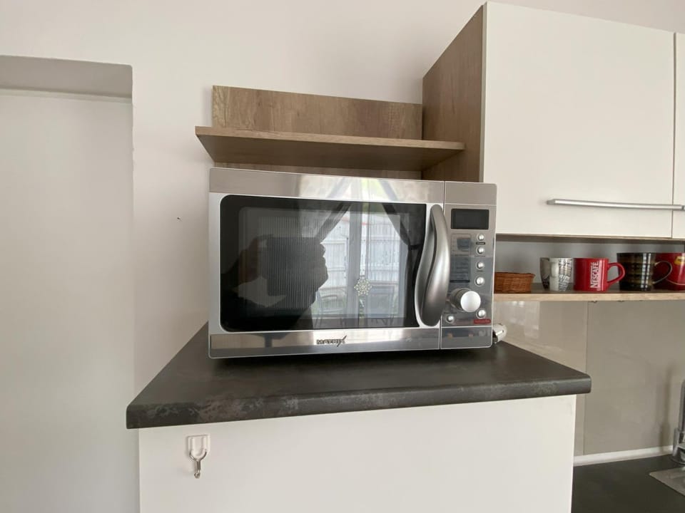 Kitchen or kitchenette, microwave