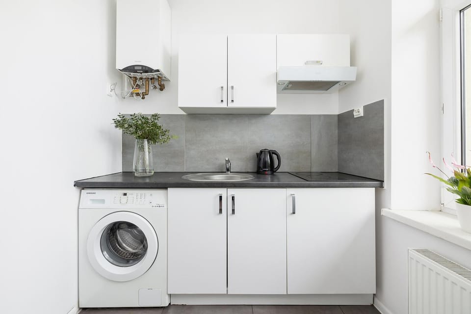 Kitchen or kitchenette, stove, washing machine