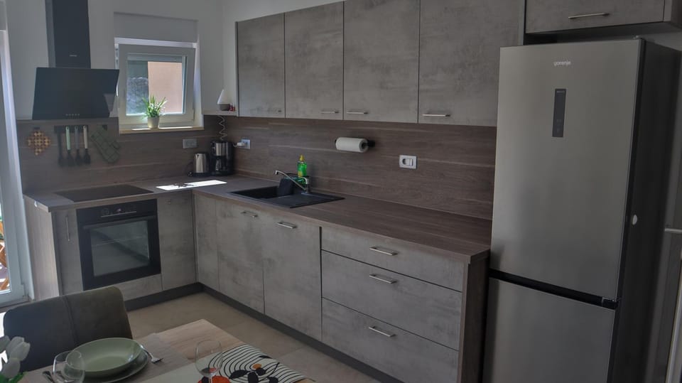 Kitchen or kitchenette, dishwasher, oven, stove