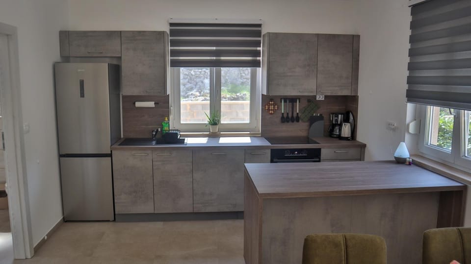 Kitchen or kitchenette, oven, stove, air conditioner