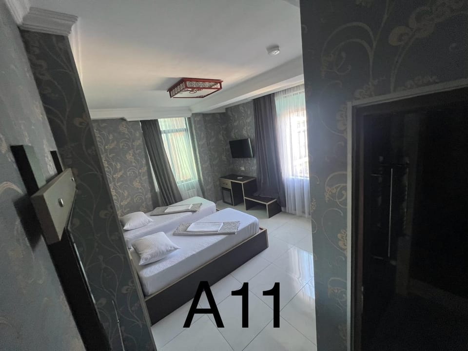 Bed, Text overlay, towels