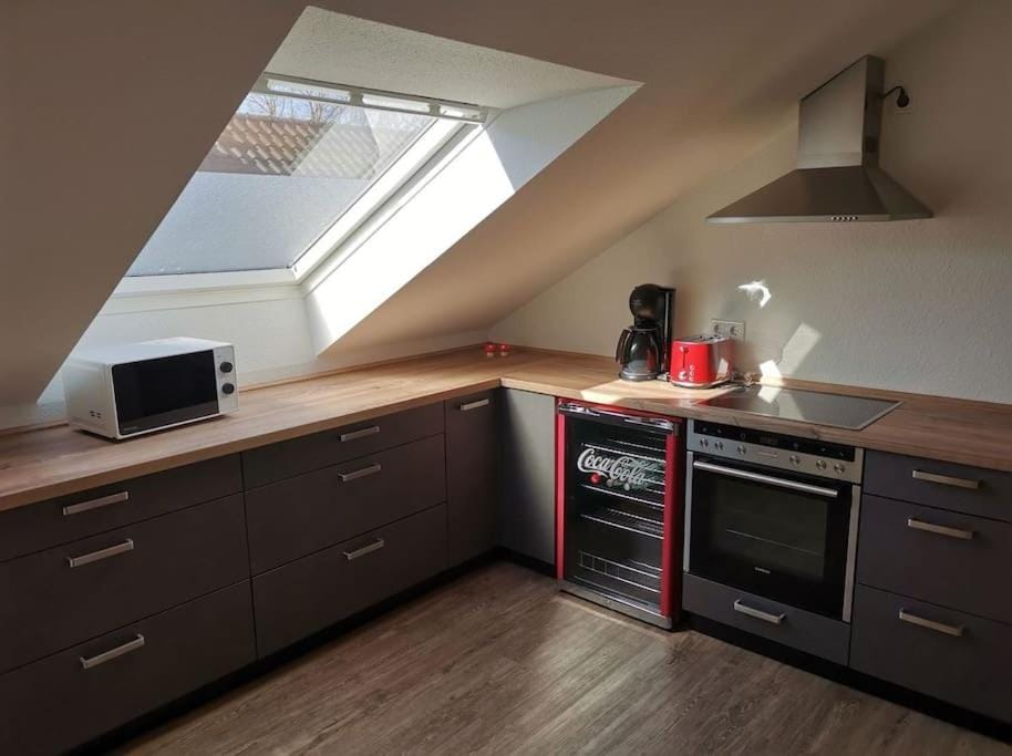 Kitchen or kitchenette, dishwasher, oven, stove, toaster