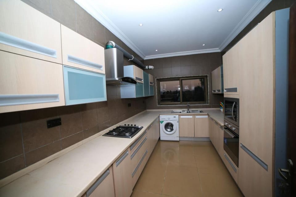 Kitchen or kitchenette, oven, stove, washing machine